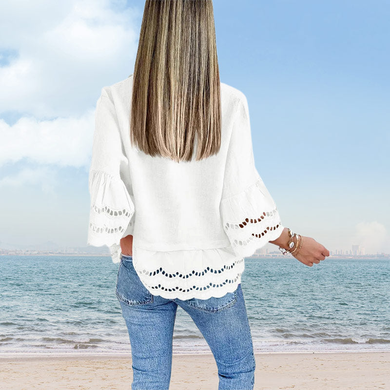 Sima blúz kiszélesedő ujjakkal, alján kivágással