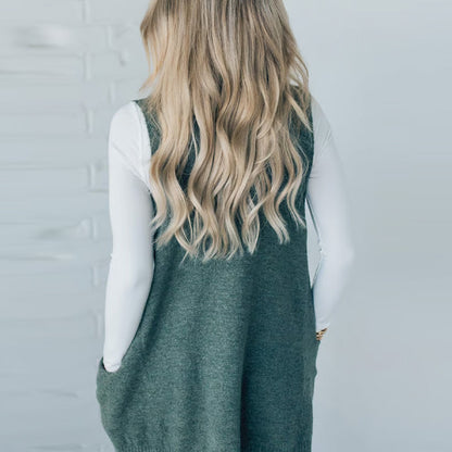 Női bő szabású pulóver V-nyakkal és zsebekkel