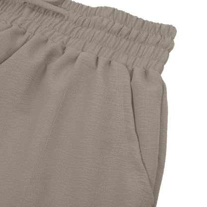 Női lezser, rugalmas, széles szárú nadrág zsebekkel